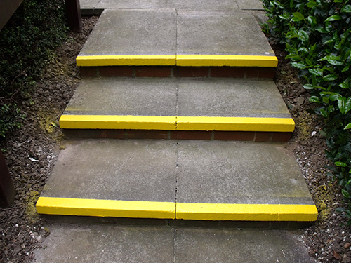 PAINT A YELLOW STRIPE ON ALL THE STEPS 